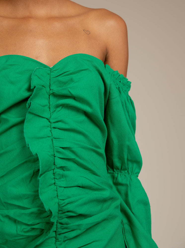 
            
                Load image into Gallery viewer, TAMIA - GREEN OFF SHOULDER BODYCON DRESS WITH RUFFLE FRONT DETAIL
            
        